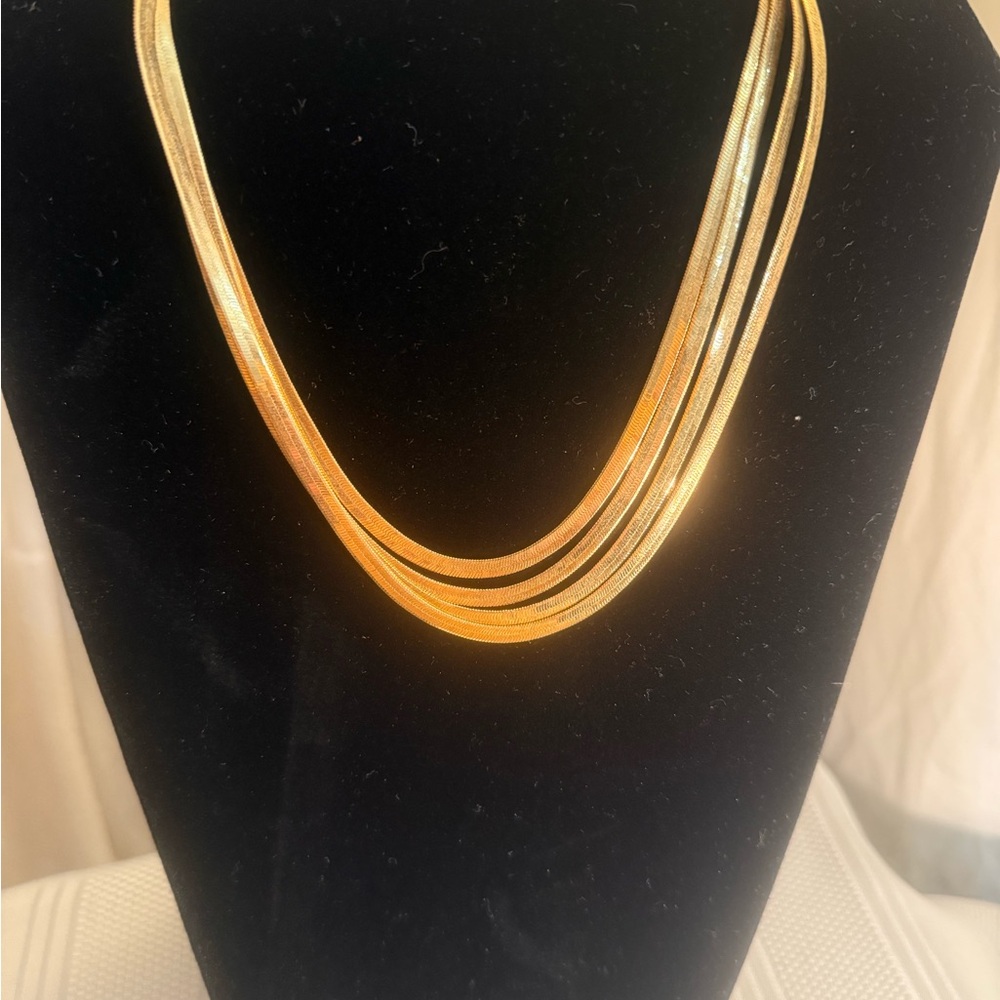 3 piece set. Elegant Gold and Silver necklaces and two tone earrings.